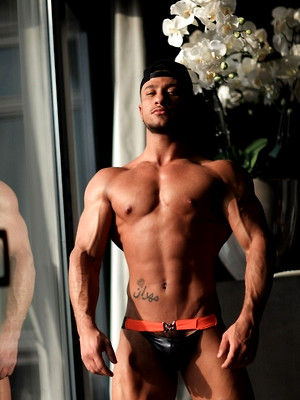 XXX gay photos of big hunk near window