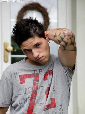Hot boys nude photos - Tattooed stud Jeremy stroking his cock outdoors.