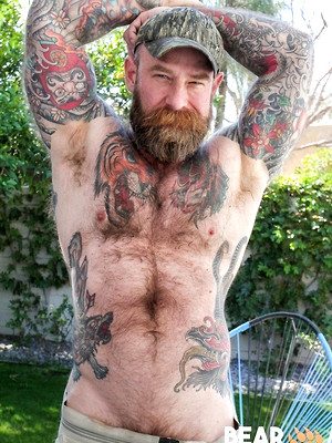 Gay sex pics with Jack Dixon shows his hairy muscled body and pierced dick
