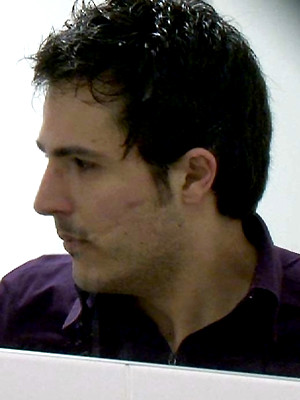 Gay pics of The pervy cameraman at Sneakypeek catches a hunky workman coming into the bus station toilet to have a crap.