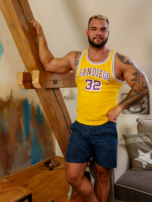 Gay sex pics with Muscle Bound Hunk Ivan Kerk Flexes His Biceps And Cock.
