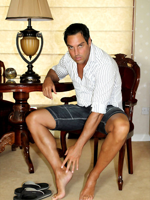 Gay sex pics with Marcello rubs his feet hard and then his cock softly