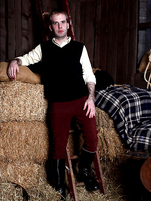XXX gay photos of Gay stud masturbating his hard cock inside a barn